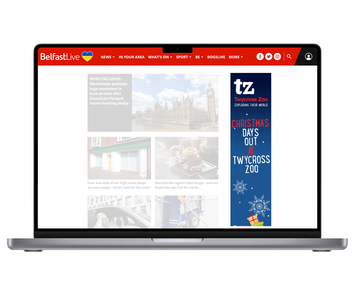 Laptop showing BelfastLive website with a retargeted skyscraper ad