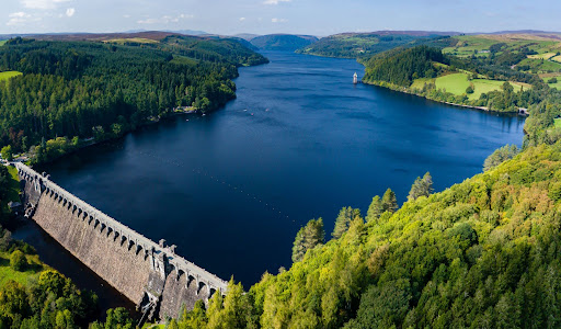 Image depicts a reservoir and a dam in English countryside